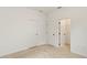 A carpeted bedroom with two closets and crisp white walls, perfect for creating a cozy and organized space at 3301 Tranquil Trl, Kissimmee, FL 34747