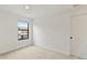 Bright bedroom with neutral carpet, white walls, a window for natural light, and a door for easy access at 3301 Tranquil Trl, Kissimmee, FL 34747