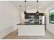 Bright kitchen featuring modern cabinets, stainless steel appliances, and granite countertops at 3301 Tranquil Trl, Kissimmee, FL 34747