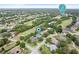 Aerial view of home nestled near a golf course at 388 Hampton Hills Ct, Debary, FL 32713
