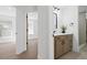 Modern bathroom featuring a wood cabinet with white marble countertop and black hardware at 388 Hampton Hills Ct, Debary, FL 32713