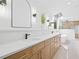 Stylish bathroom featuring a double vanity, marble countertops, and modern lighting at 388 Hampton Hills Ct, Debary, FL 32713