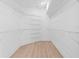 Spacious walk-in closet with custom shelving and hardwood flooring for optimal storage at 388 Hampton Hills Ct, Debary, FL 32713
