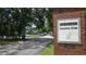 DeBary Country Club entrance featuring brick signage and a view of the parking area at 388 Hampton Hills Ct, Debary, FL 32713
