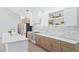 Modern kitchen featuring sleek white countertops, stylish cabinets, and stainless steel appliances at 388 Hampton Hills Ct, Debary, FL 32713