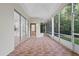 Spacious screened-in lanai showcasing tiled flooring and access to the backyard at 388 Hampton Hills Ct, Debary, FL 32713