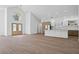 Bright open floor plan with a double-door entryway, hardwood floors, and an open-concept kitchen at 388 Hampton Hills Ct, Debary, FL 32713