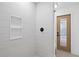Tiled shower area featuring a built-in niche and a glass-enclosed door to a toilet area at 388 Hampton Hills Ct, Debary, FL 32713