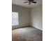 Comfortable bedroom with neutral walls, carpet and a ceiling fan at 4034 Bougainvillea Pl, Kissimmee, FL 34746
