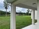 Covered patio with scenic view of the pond and palm trees at 4034 Bougainvillea Pl, Kissimmee, FL 34746