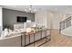 Open-concept living room with stylish furniture, plank flooring, and elegant decor, offering a cozy and inviting atmosphere at 4120 Winding Pines Dr, Apopka, FL 32712