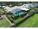 Aerial view featuring a pool, green yard, and tasteful landscaping at 414 Bonifay Ave, Orlando, FL 32825