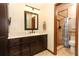 Neutral bathroom with dark wood cabinets and a tile shower at 414 Bonifay Ave, Orlando, FL 32825