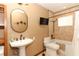 Cozy bathroom with a bathtub, shower, sink, TV, and wood accents at 414 Bonifay Ave, Orlando, FL 32825