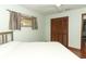 Bedroom features a double bed, wood floors, and neutral walls at 414 Bonifay Ave, Orlando, FL 32825