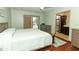 Bedroom boasts an ensuite bathroom, walk in closet, and sliding glass doors to the lanai at 414 Bonifay Ave, Orlando, FL 32825