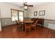 Traditional dining room with wood floors, wainscoting, and a large window at 414 Bonifay Ave, Orlando, FL 32825