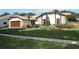 Charming single-story home boasts a well-manicured lawn and stone accents at 414 Bonifay Ave, Orlando, FL 32825