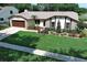 Charming single-story home featuring a stone accent exterior, attached garage, and a well-maintained lawn at 414 Bonifay Ave, Orlando, FL 32825