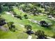 Scenic aerial view of lush green golf course highlighting the manicured fairways and strategically placed trees at 414 Bonifay Ave, Orlando, FL 32825