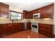 Well-equipped kitchen with custom cabinets, stainless steel appliances, and granite countertops at 414 Bonifay Ave, Orlando, FL 32825