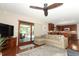 Open living room view to the kitchen and sliding glass doors to the lanai at 414 Bonifay Ave, Orlando, FL 32825
