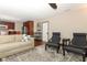 Cozy living room with fireplace, ceiling fan, wood floors and open view to the kitchen at 414 Bonifay Ave, Orlando, FL 32825