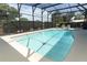 Enclosed pool with clear blue water and a turtle tile, surrounded by lush greenery and seating at 414 Bonifay Ave, Orlando, FL 32825