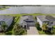 Aerial view of the home with a large lake in the background and a well-manicured lawn at 4632 Egg Harbor Dr, Kissimmee, FL 34746