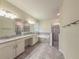 Bright bathroom features double sinks, granite counters, and separate tub and shower at 4632 Egg Harbor Dr, Kissimmee, FL 34746
