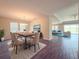 Elegant dining room with a modern chandelier, stylish furniture, and wood floors at 4632 Egg Harbor Dr, Kissimmee, FL 34746
