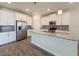 Bright, modern kitchen with white cabinets, granite countertops, and stainless steel appliances at 4632 Egg Harbor Dr, Kissimmee, FL 34746