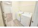 Laundry room including washer and dryer set along with storage and closet space at 4632 Egg Harbor Dr, Kissimmee, FL 34746