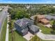 Aerial view of a two-story home with a gray exterior, solar panels, and manicured landscaping at 470 Regal Downs Cir, Winter Garden, FL 34787