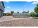 Expansive backyard featuring a patio, above ground pool, and beautiful landscaping at 470 Regal Downs Cir, Winter Garden, FL 34787