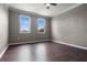 Spacious bedroom with warm colored walls and hardwood floors and large windows at 470 Regal Downs Cir, Winter Garden, FL 34787
