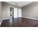 Bedroom with dark floors, white trim and ample closet space and a connecting room at 470 Regal Downs Cir, Winter Garden, FL 34787
