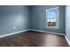 Light-filled carpet-free bedroom with a window and neutral walls, creating a comfortable and inviting space at 470 Regal Downs Cir, Winter Garden, FL 34787