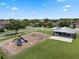 A vibrant neighborhood park with playground, swings and a shaded picnic area for community fun at 470 Regal Downs Cir, Winter Garden, FL 34787