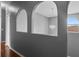 Hallway featuring decorative arches, a pendant light, and elegant design, providing a touch of architectural charm at 470 Regal Downs Cir, Winter Garden, FL 34787
