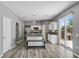Bright kitchen featuring an island with granite countertop and a bench, alongside stainless steel appliances at 470 Regal Downs Cir, Winter Garden, FL 34787
