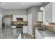Bright kitchen features granite counters, stainless appliances, and ample cabinet space at 470 Regal Downs Cir, Winter Garden, FL 34787