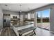 Modern kitchen featuring granite countertops, stainless steel appliances, and sliding glass doors to the back yard at 470 Regal Downs Cir, Winter Garden, FL 34787