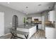 Kitchen with stainless steel appliances, granite counters, tile backsplash, a large island, and pendant lighting at 470 Regal Downs Cir, Winter Garden, FL 34787