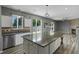 Modern open floor plan featuring a spacious kitchen and connecting living room at 470 Regal Downs Cir, Winter Garden, FL 34787