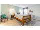 This bedroom features sleek wood floors, a zebra print rug, and a stylish chair with colorful pillows at 489 Meadowood Blvd, Fern Park, FL 32730