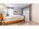 This bedroom features wood floors, a zebra print rug, and large sliding glass doors at 489 Meadowood Blvd, Fern Park, FL 32730