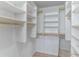 Walk-in closet features custom shelving and gold-toned hardware at 489 Meadowood Blvd, Fern Park, FL 32730