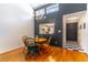 Cozy dining area with hardwood floors and views into the kitchen at 489 Meadowood Blvd, Fern Park, FL 32730