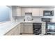 Updated kitchen with marble countertops, subway tile backsplash, and stainless steel appliances at 489 Meadowood Blvd, Fern Park, FL 32730